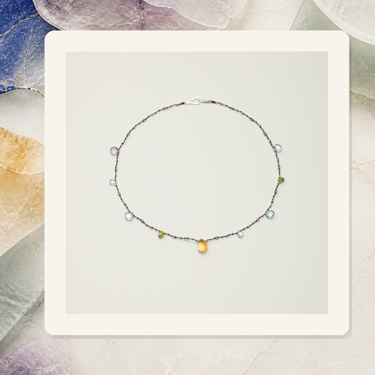 Blue topaz, ametrine and citrine necklace illustrating crystal colors in jewelry