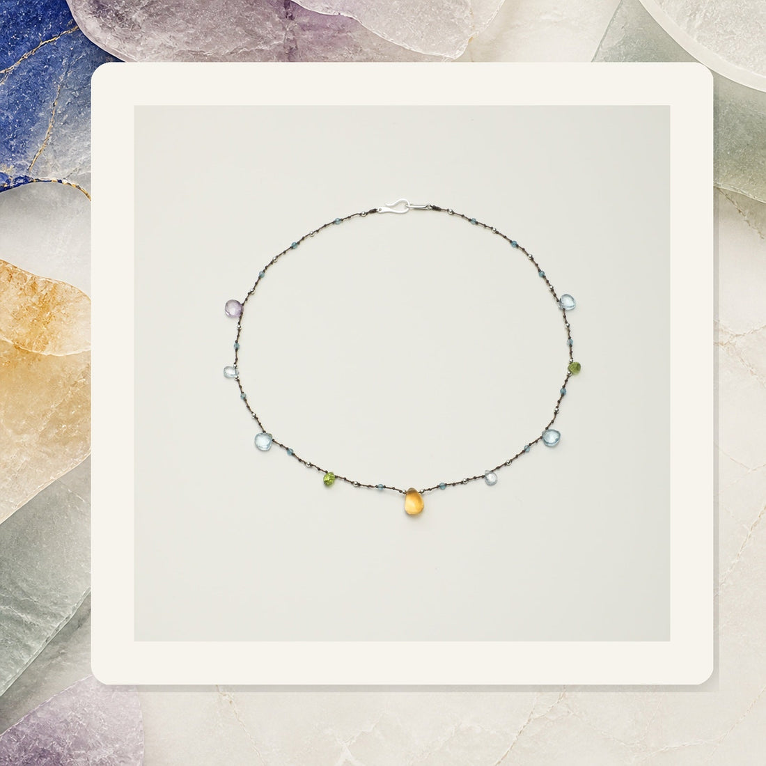 Blue topaz, ametrine and citrine necklace illustrating crystal colors in jewelry
