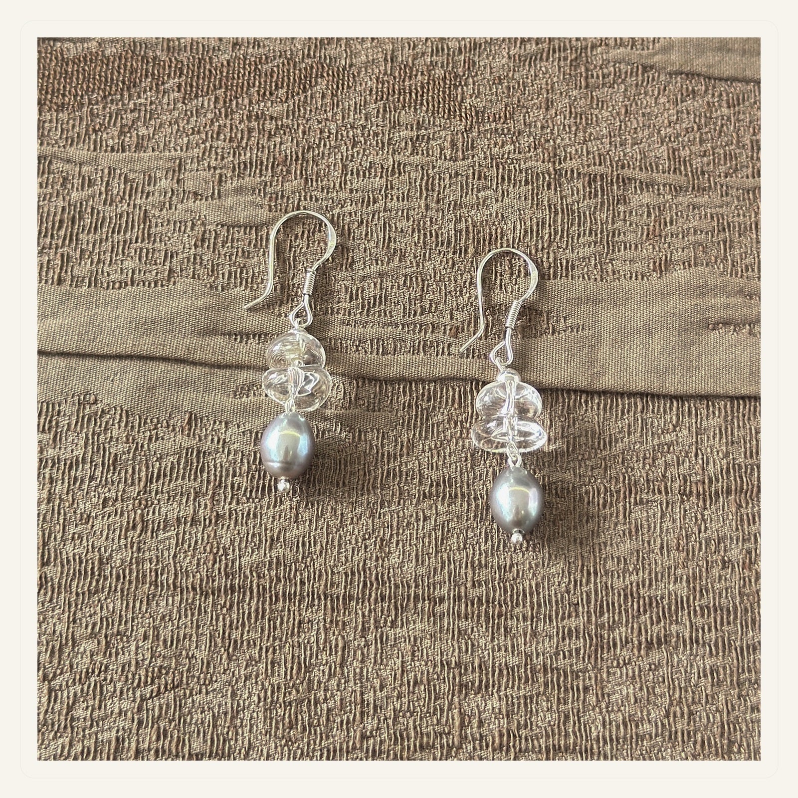 Crystal grey pearl drop earrings representing the Mineralyra earring collection