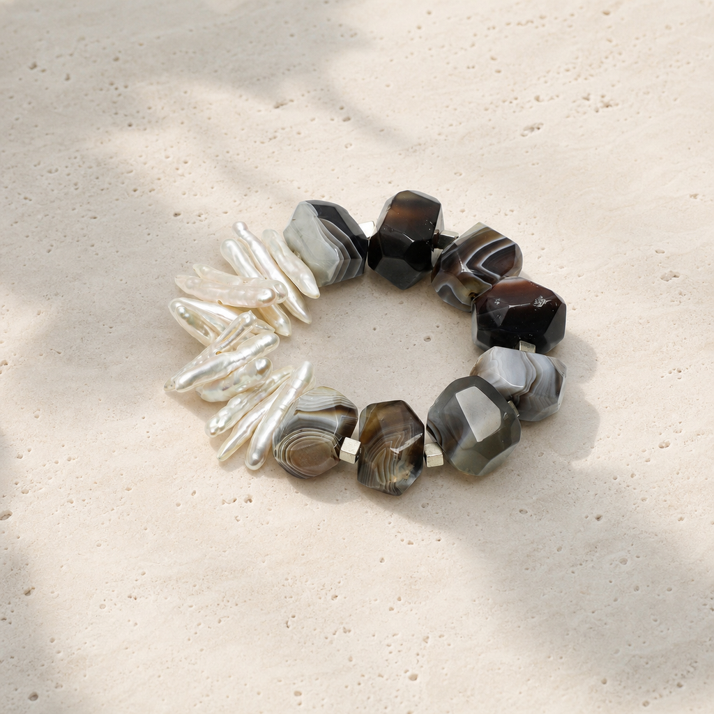 Agate baroque pearl branch bracelet on a warm ivory studio background