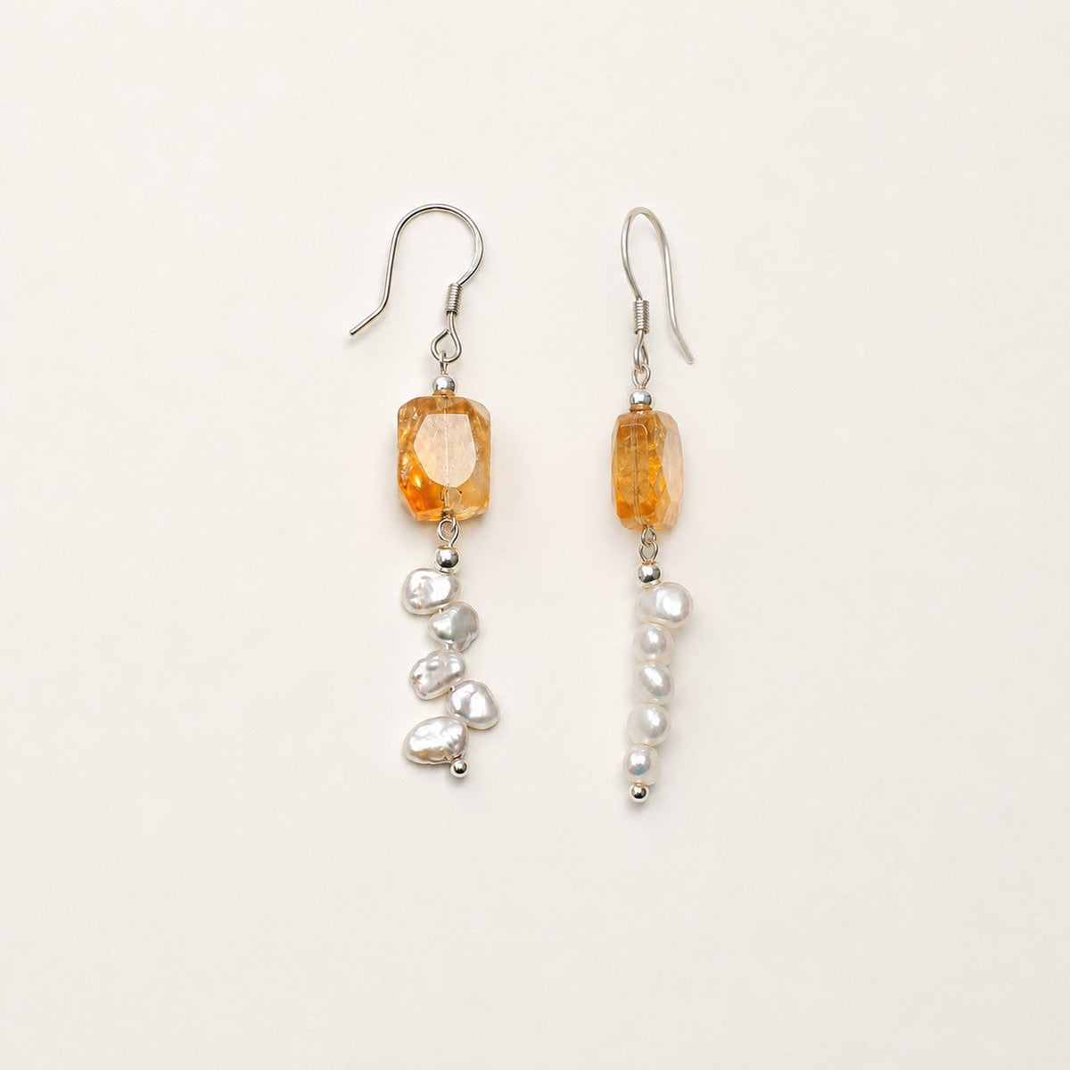 Citrine and baroque pearl earring pair shown from front and side angles
