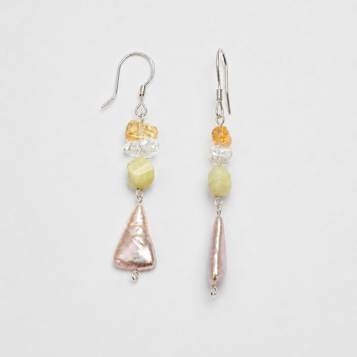 Citrine, clear quartz and freshwater pearl earring pair shown from front and side angles