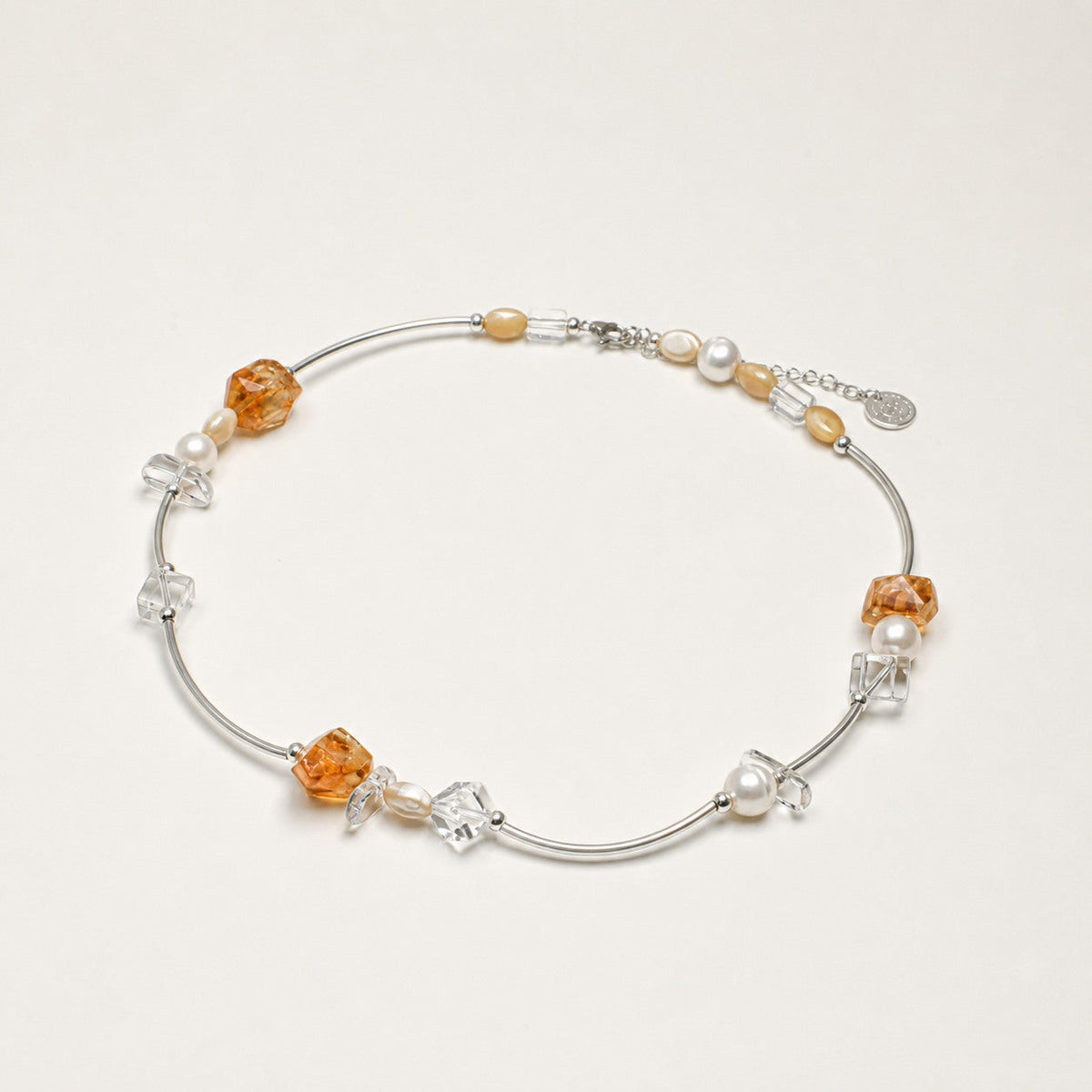 Citrine, clear quartz and pearl necklace shown from an alternate angle with its structure visible