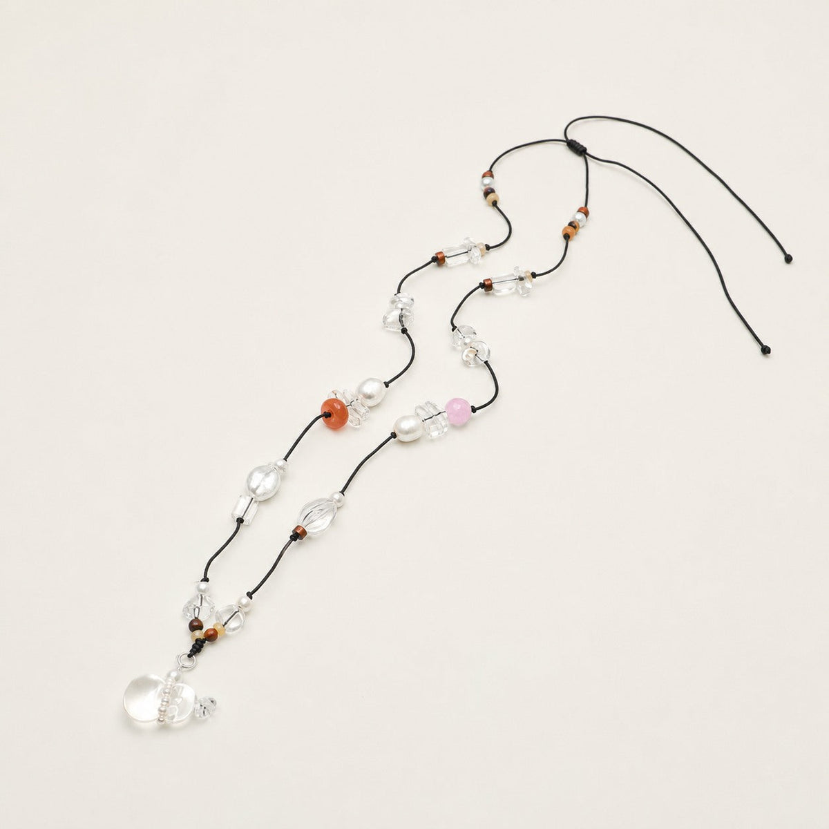Long citrine, clear quartz and rose quartz necklace shown from an alternate angle