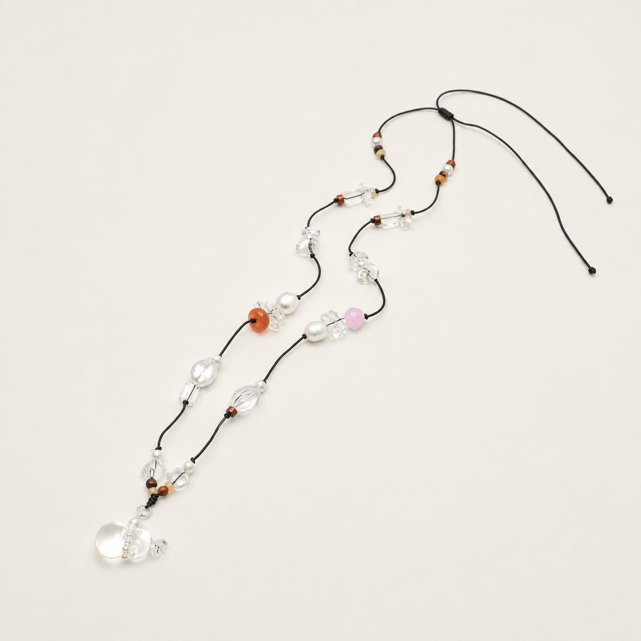 Long citrine, clear quartz and rose quartz necklace shown from an alternate angle