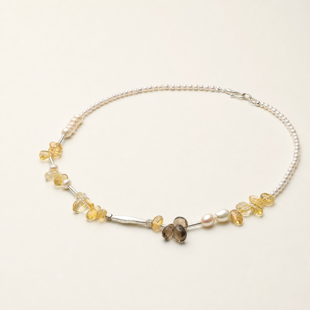 Citrine and freshwater pearl necklace shown from an alternate angle with its full structure visible
