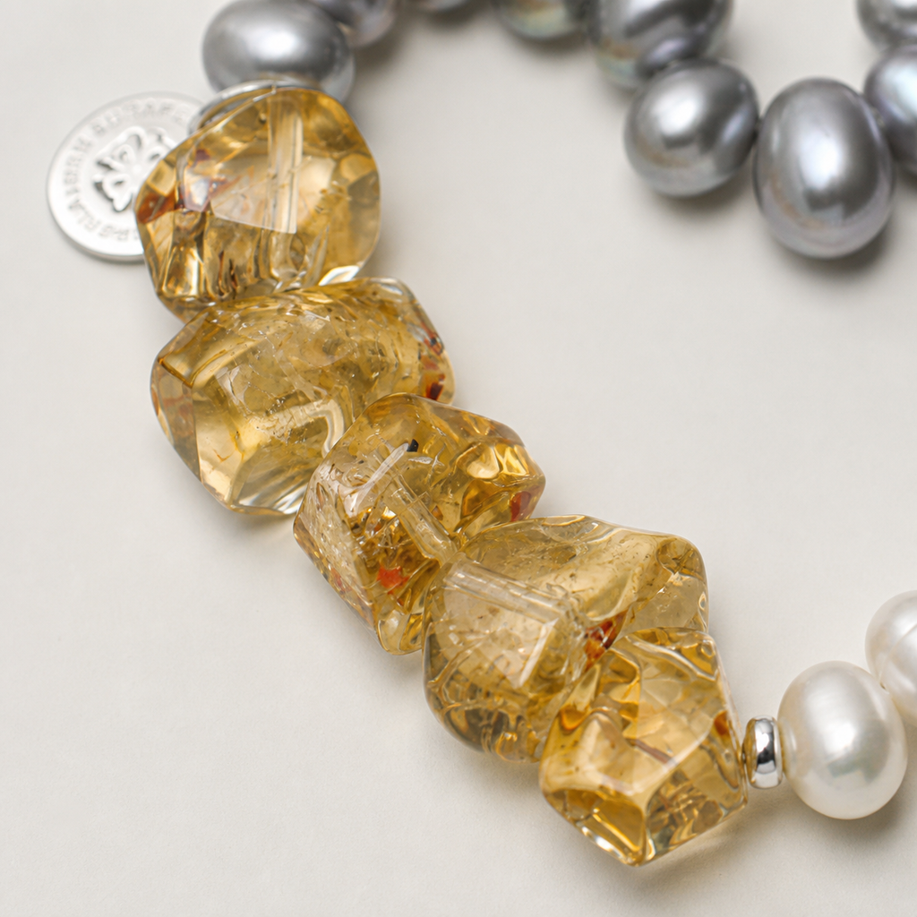Citrine and grey pearl bracelet natural materials and silver workmanship close-up