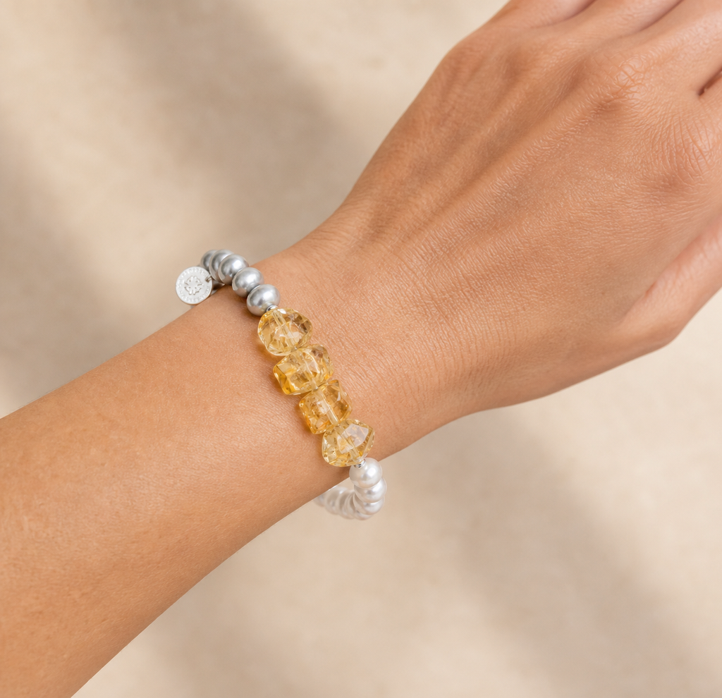 Citrine and grey pearl bracelet worn correctly on wrist at realistic scale