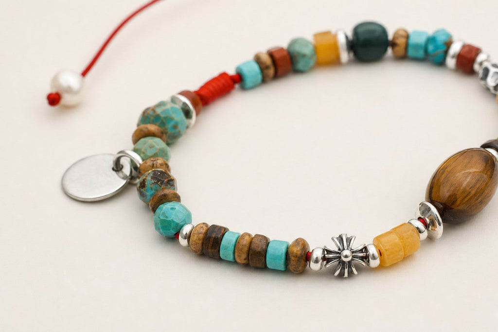 Close-up of malachite, turquoise, tiger's eye, citrine and sterling silver bracelet workmanship