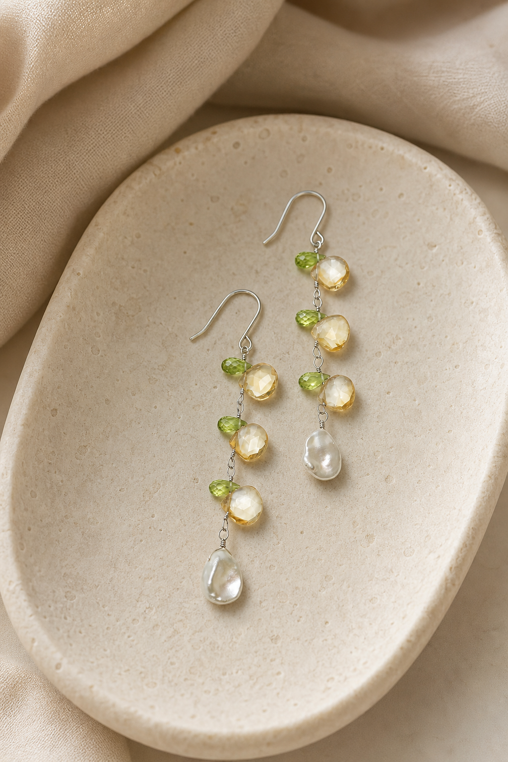 Golden Tassel Citrine & Peridot Drop Earrings in an atmospheric still-life setting