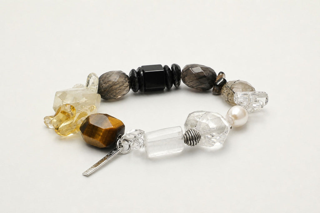 Citrine and smoky quartz mixed-stone bracelet shown from a low alternate angle