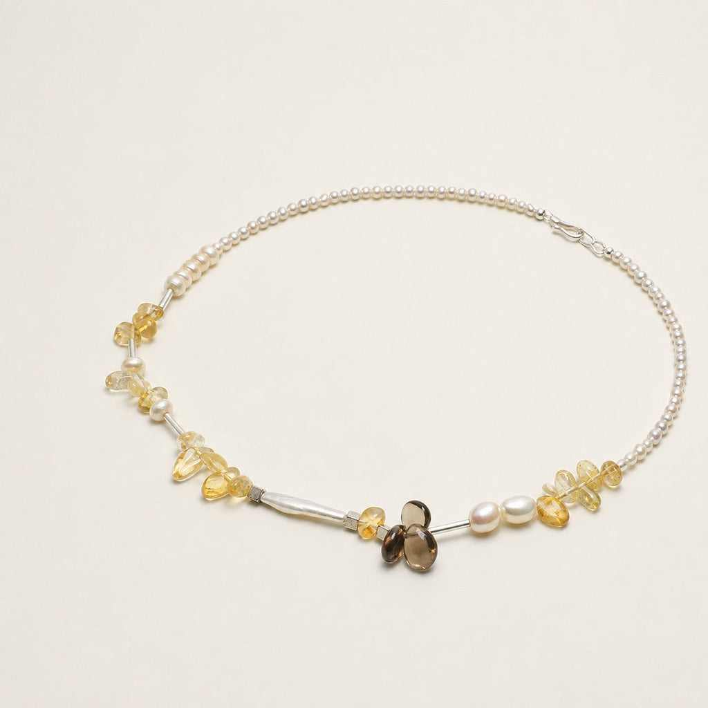 Citrine, smoky quartz and pearl necklace shown from an alternate angle with its full structure visible