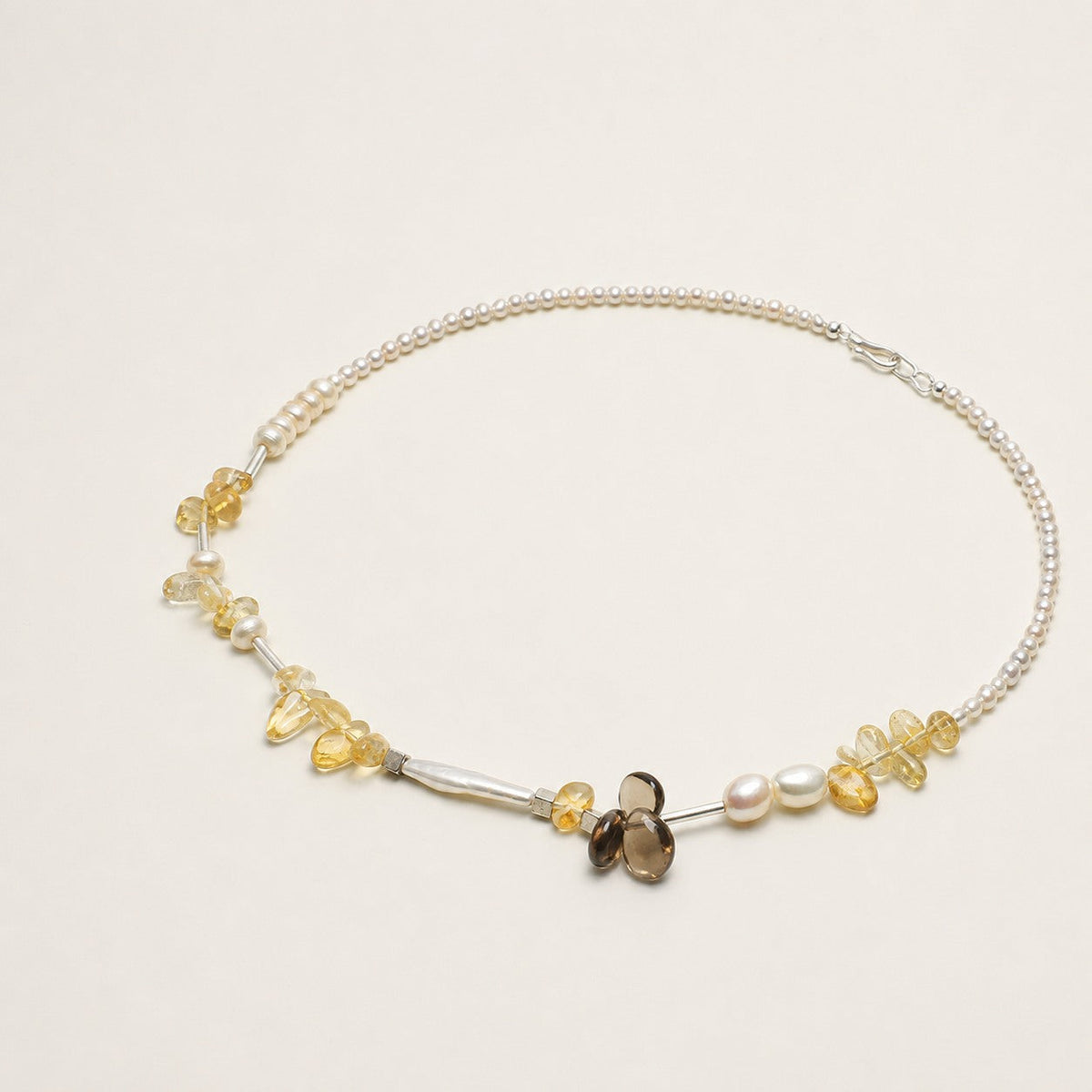 Citrine, smoky quartz and pearl necklace shown from an alternate angle with its full structure visible