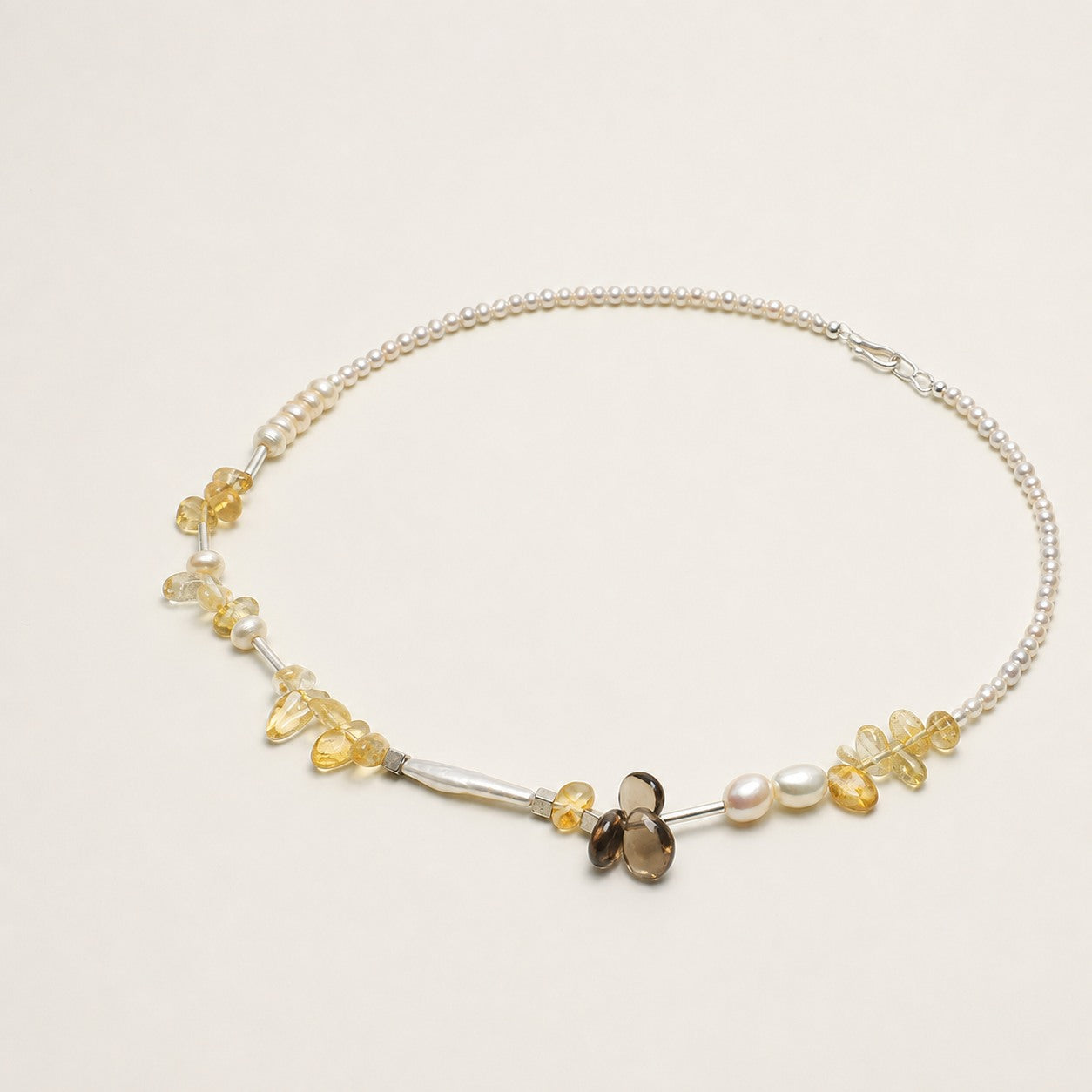 Citrine, smoky quartz and pearl necklace shown from an alternate angle with its full structure visible