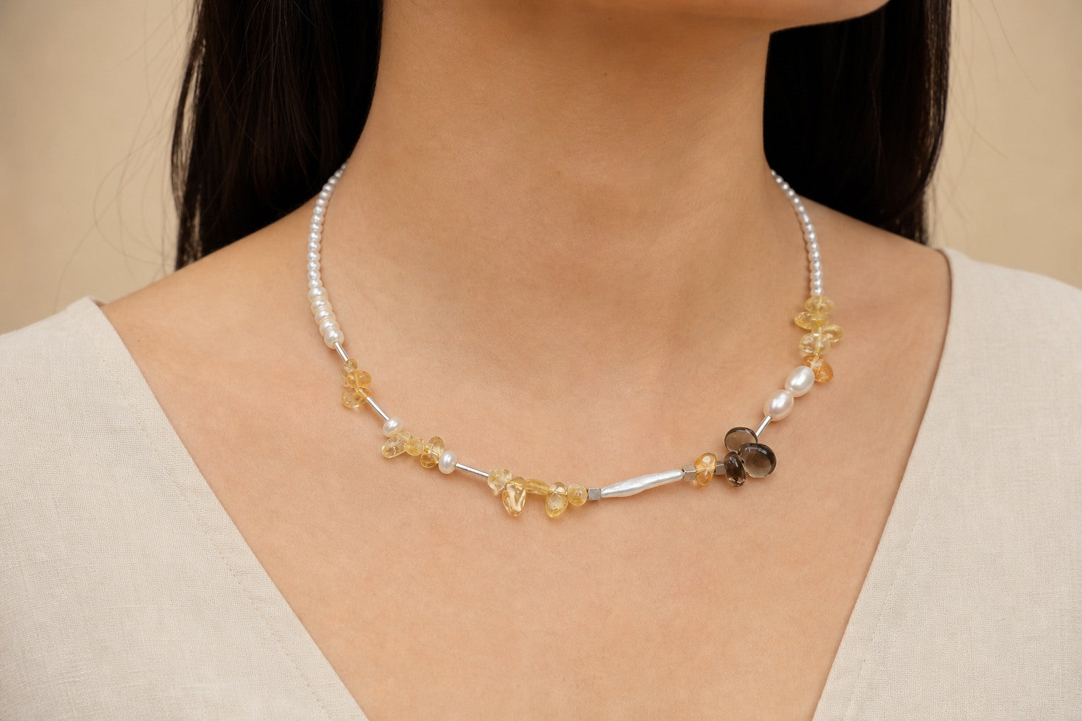 Citrine, smoky quartz and pearl necklace worn around the neck at realistic 47 cm scale