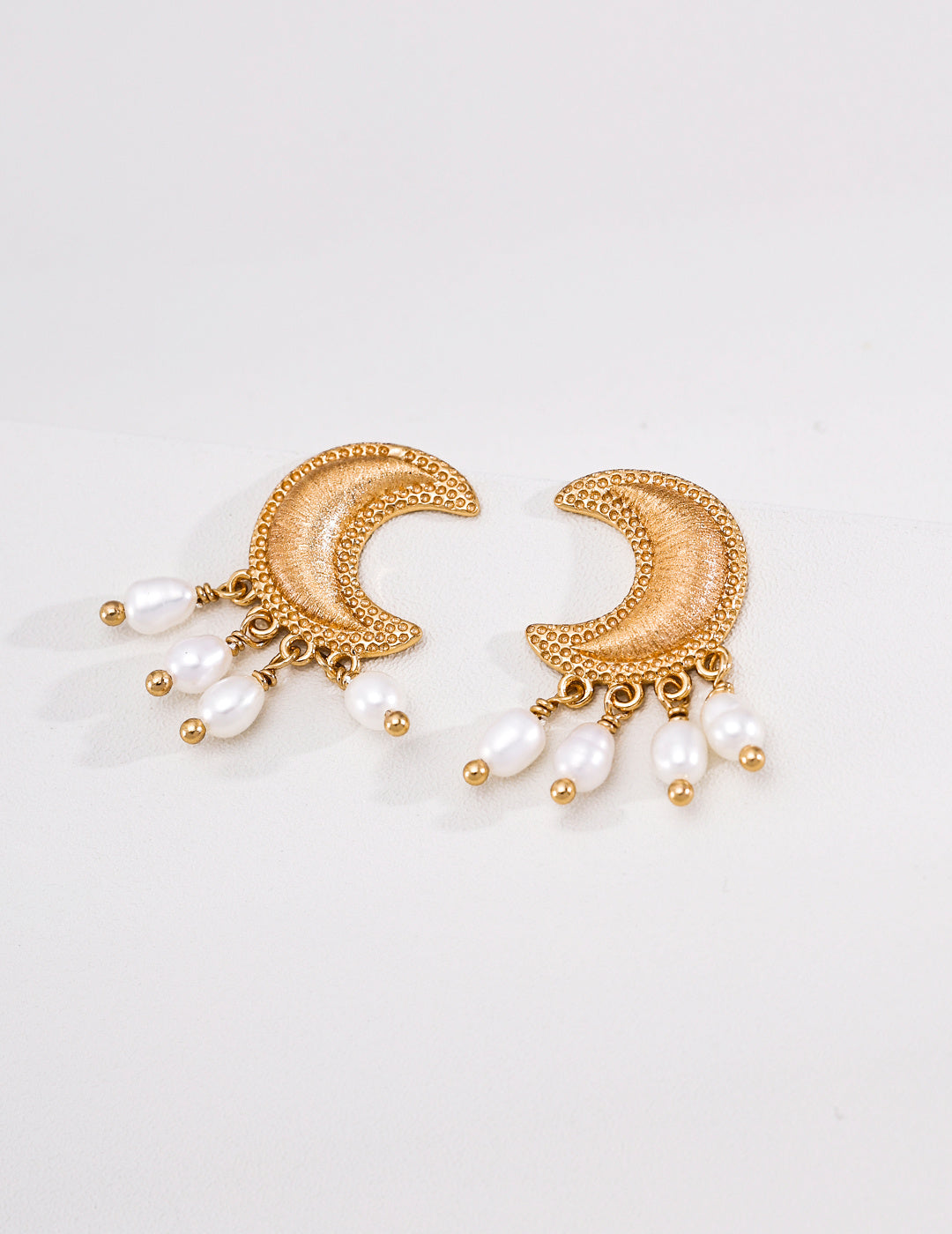 Vintage gold-tone crescent moon earrings with pearl drops