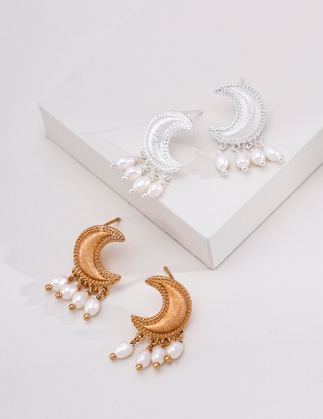 Pearl crescent moon earrings in silver and vintage gold tones