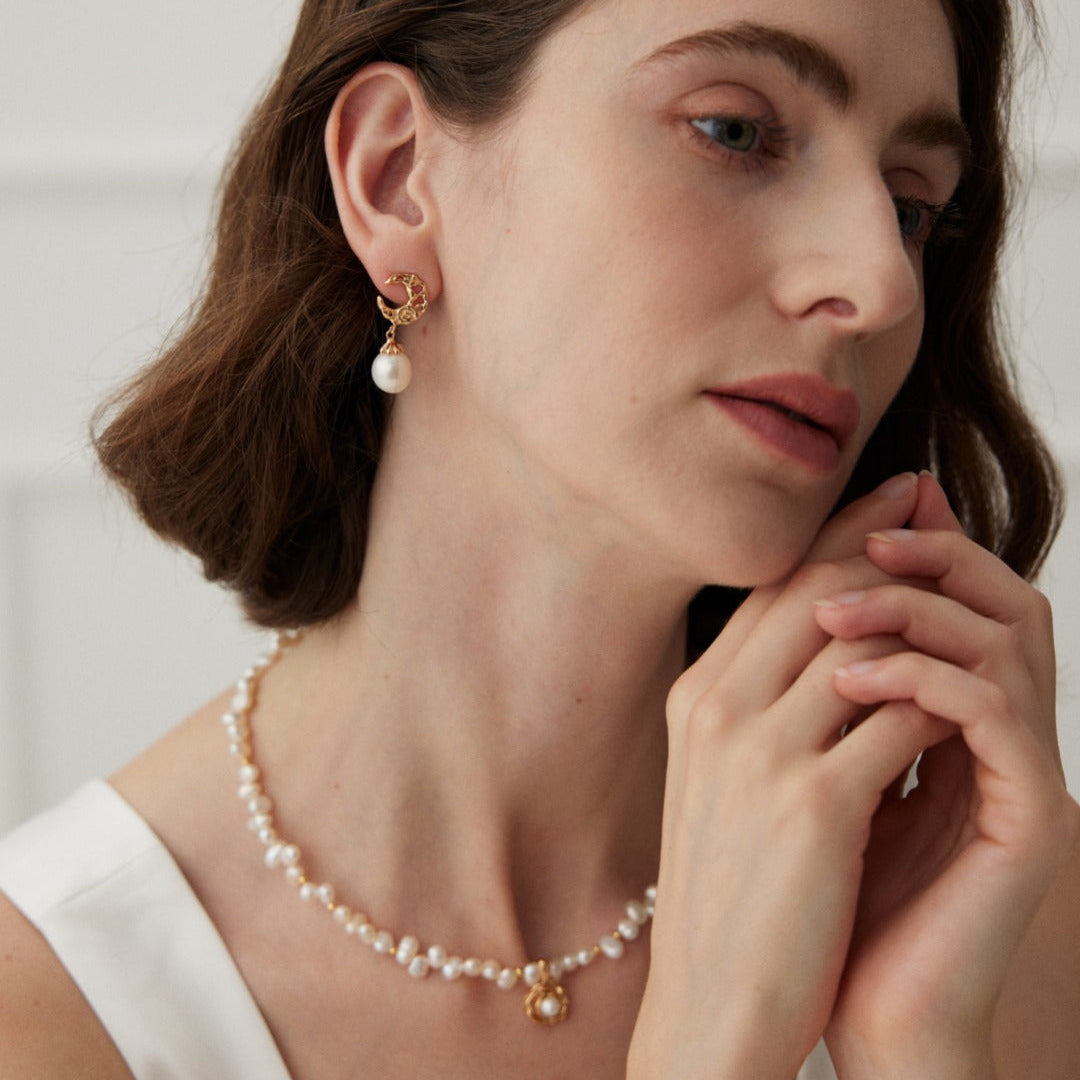 Model wearing the camellia pearl necklace with earrings