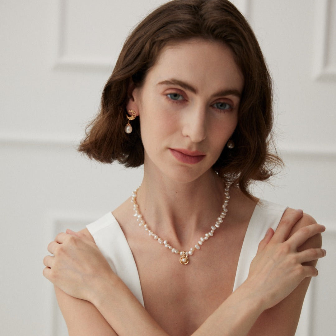 Camellia pearl necklace styled with a white outfit