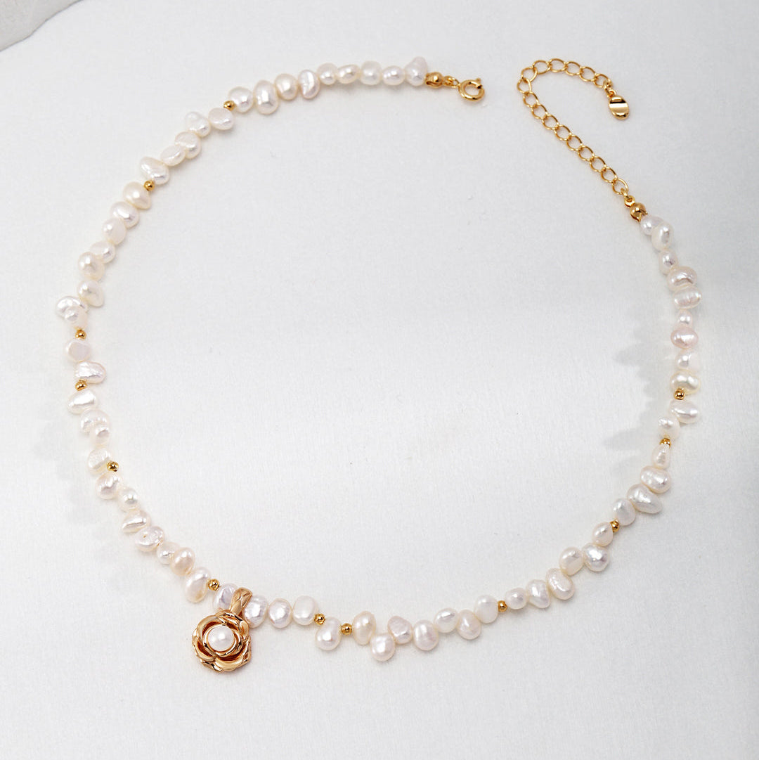 Camellia pearl necklace with antique gold-tone details and extension chain