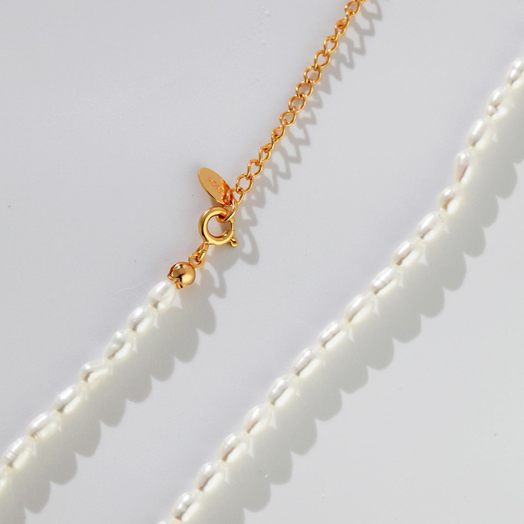 Close-up of the rice pearl necklace clasp and extension chain