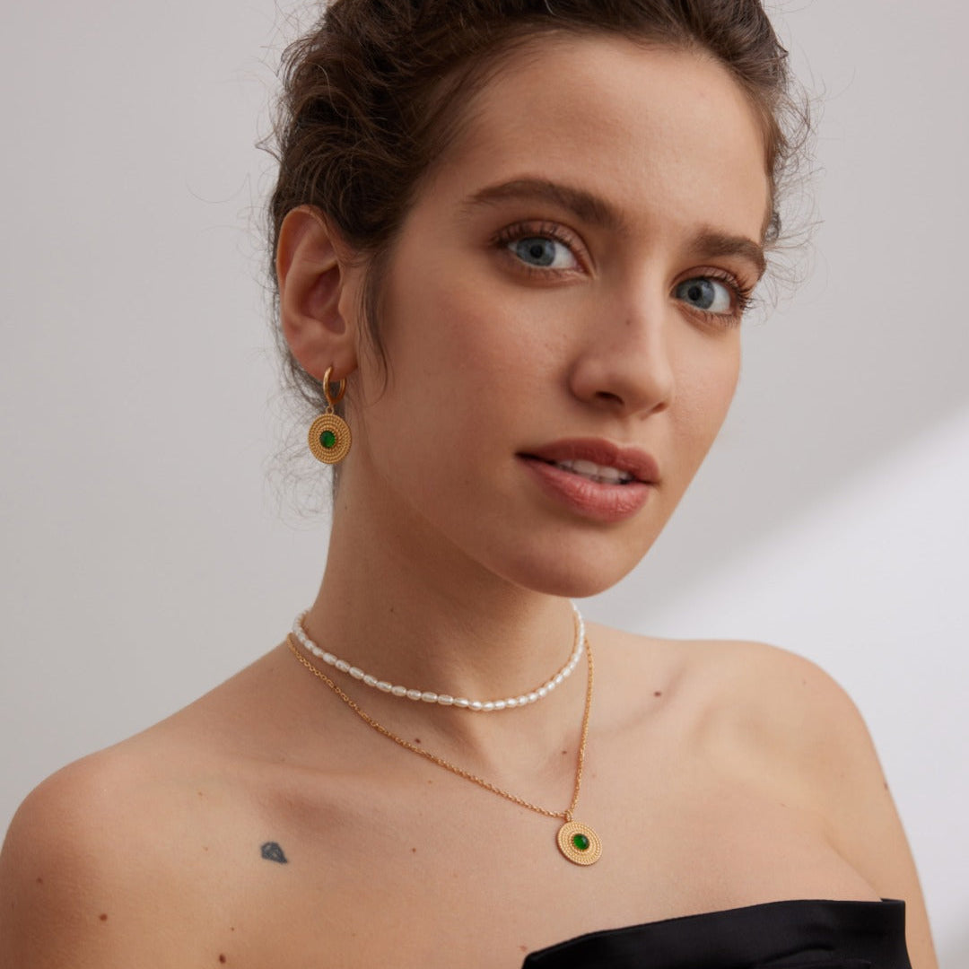 Portrait styling photograph of layered necklaces with a fine pearl strand