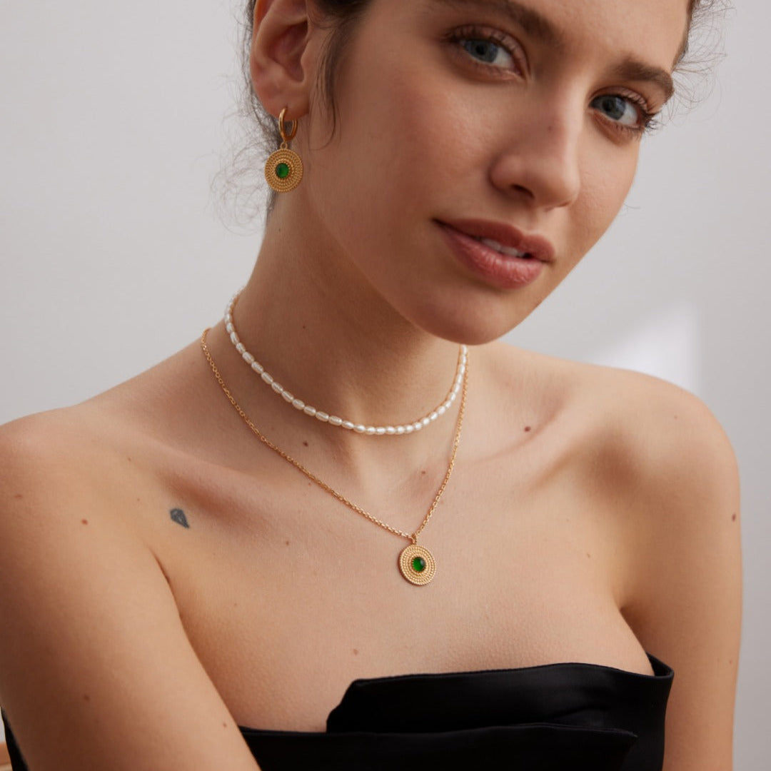 Layered necklace styling photograph with a fine pearl strand