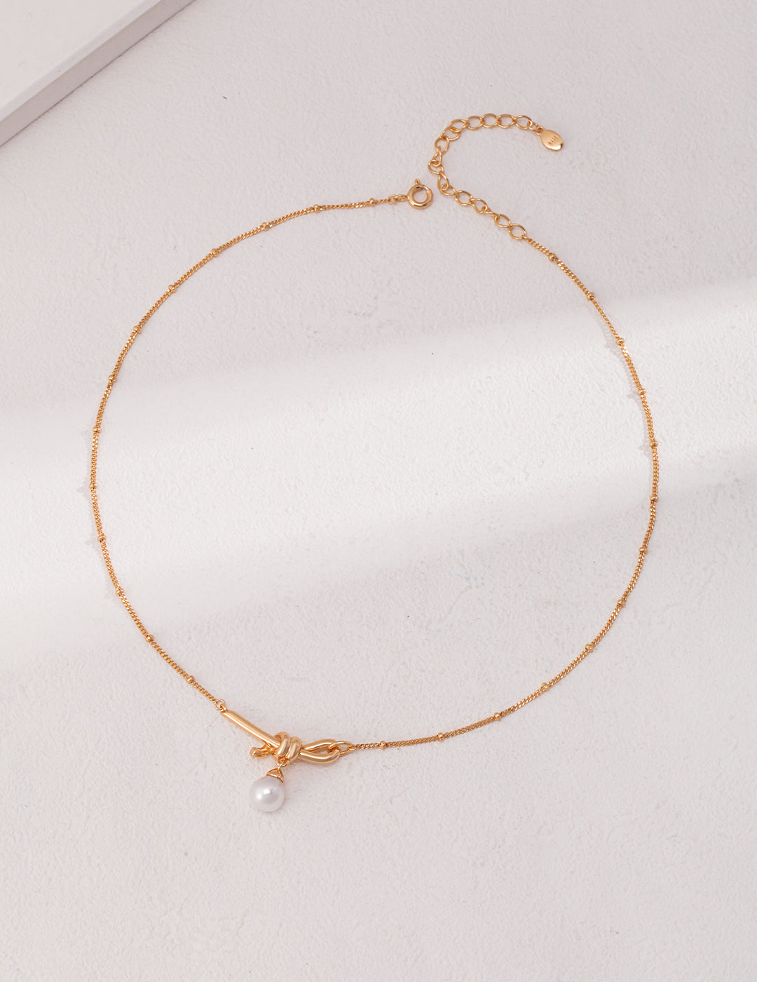 Knotted Pearl Drop Necklace — product view