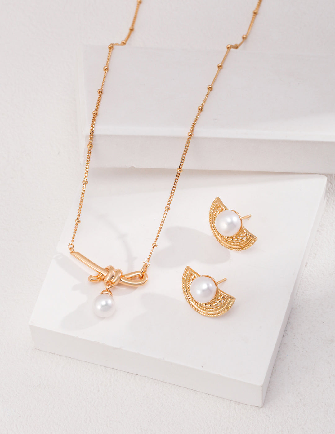 Knotted Pearl Drop Necklace — detail or styling view; other jewelry sold separately