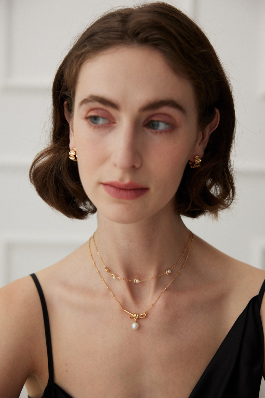 Knotted Pearl Drop Necklace — detail or styling view; other jewelry sold separately