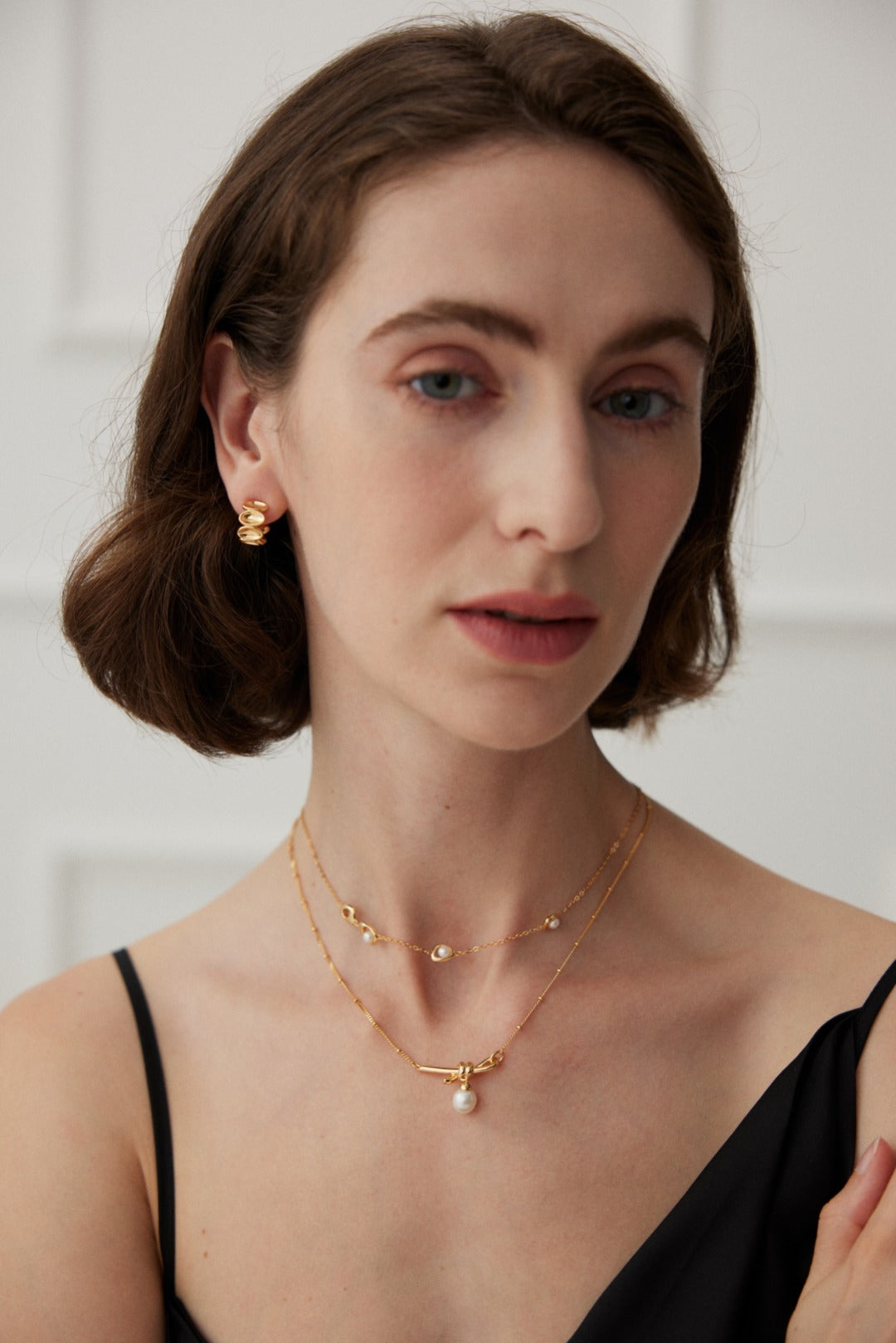 Knotted Pearl Drop Necklace — detail or styling view; other jewelry sold separately