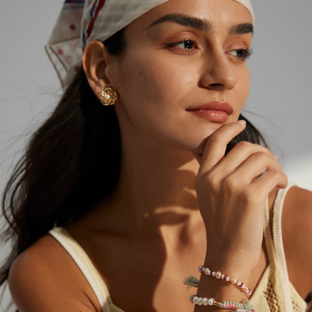 Layered Flower Pearl Stud Earrings — product and styling view; other jewellery sold separately