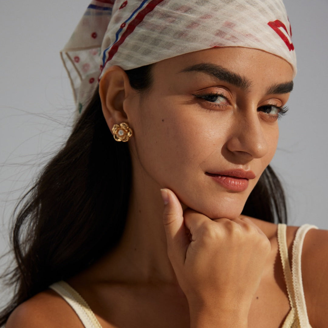 Layered Flower Pearl Stud Earrings — product and styling view; other jewellery sold separately