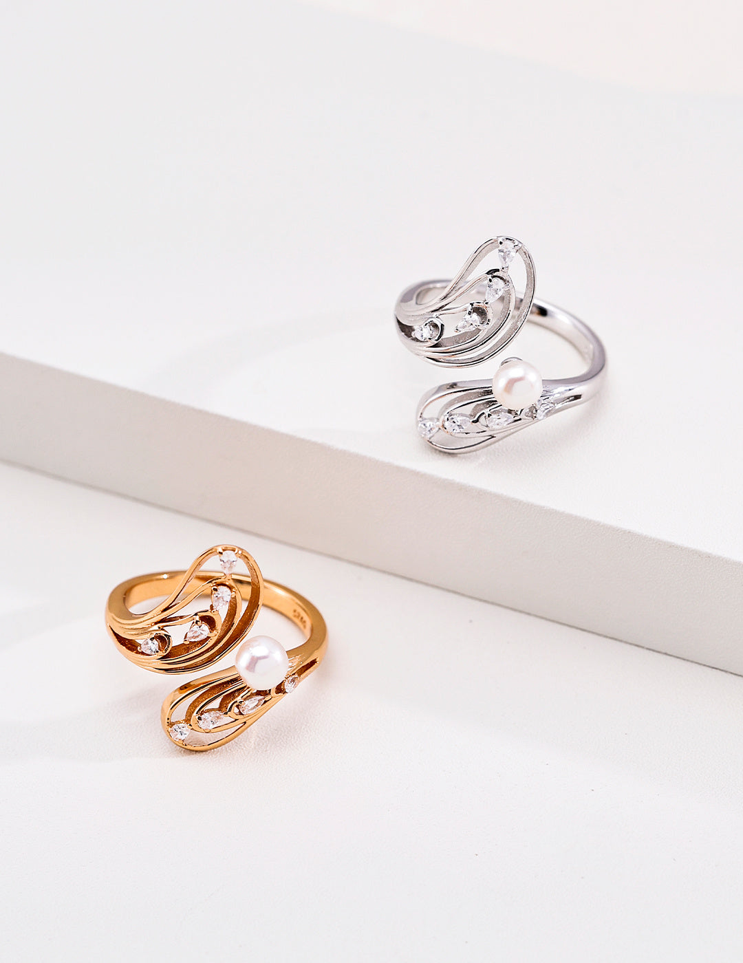 Pearl openwork butterfly rings in silver and vintage gold tones