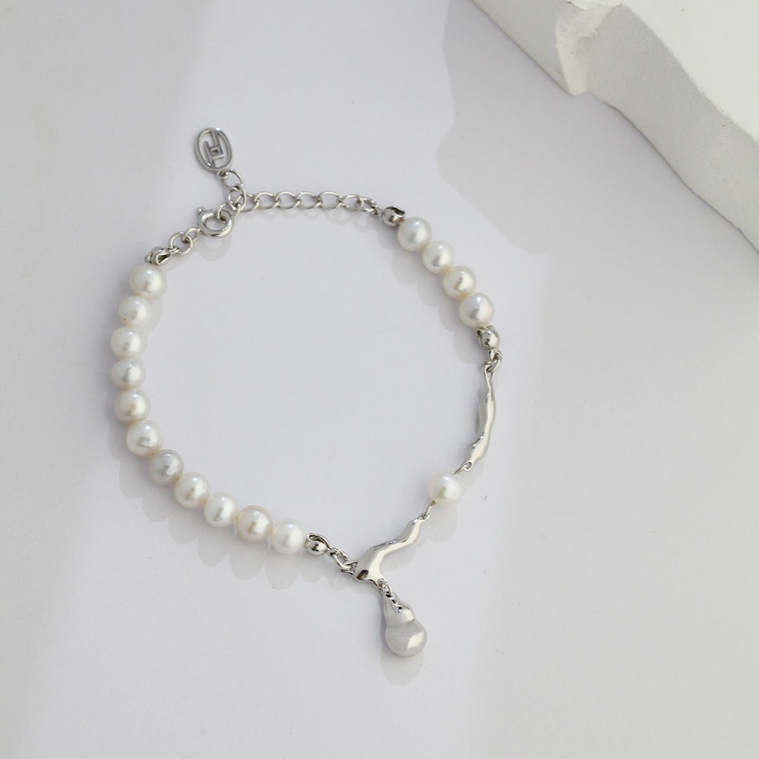 Silver-tone pearl chain bracelet with a small pearl drop