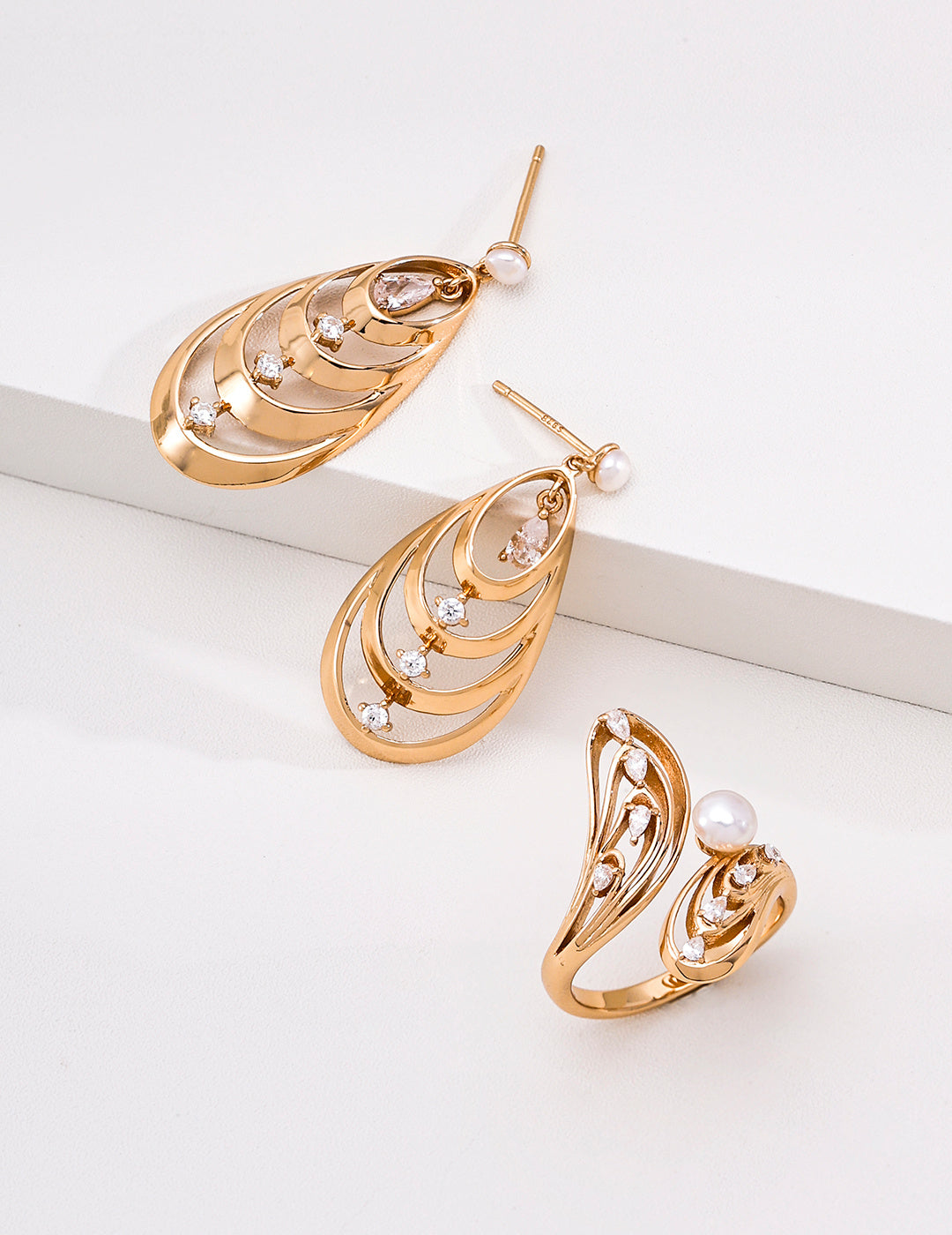 Pearl butterfly ring styled with coordinating earrings sold separately