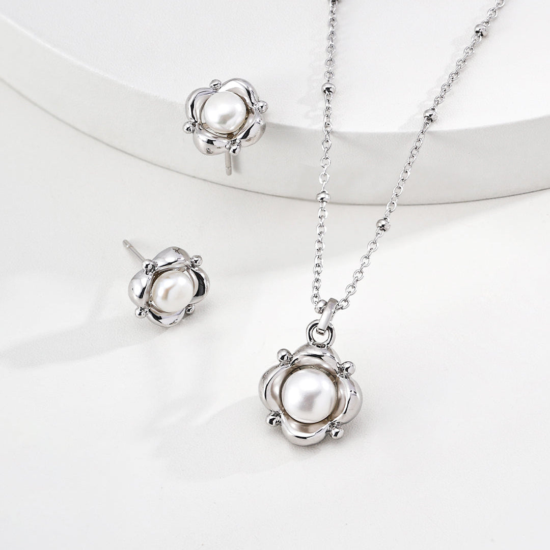 Petite Pearl Flower Stud Earrings — product and styling view; other jewellery sold separately