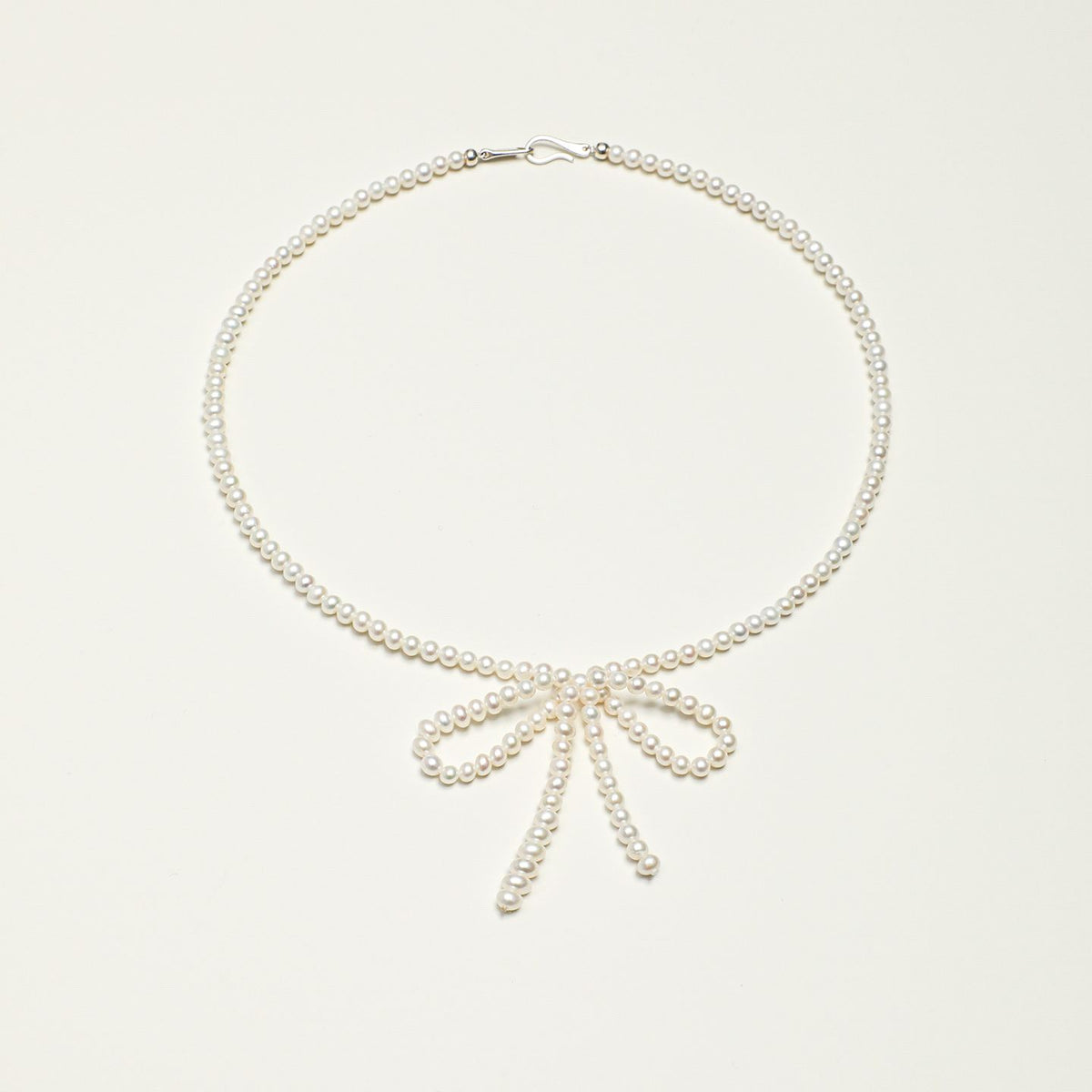 Seed Pearl Bow Necklace - Silver Hook - product photograph