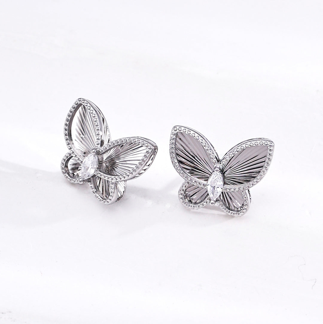 Silver-tone butterfly stud earrings with textured wings