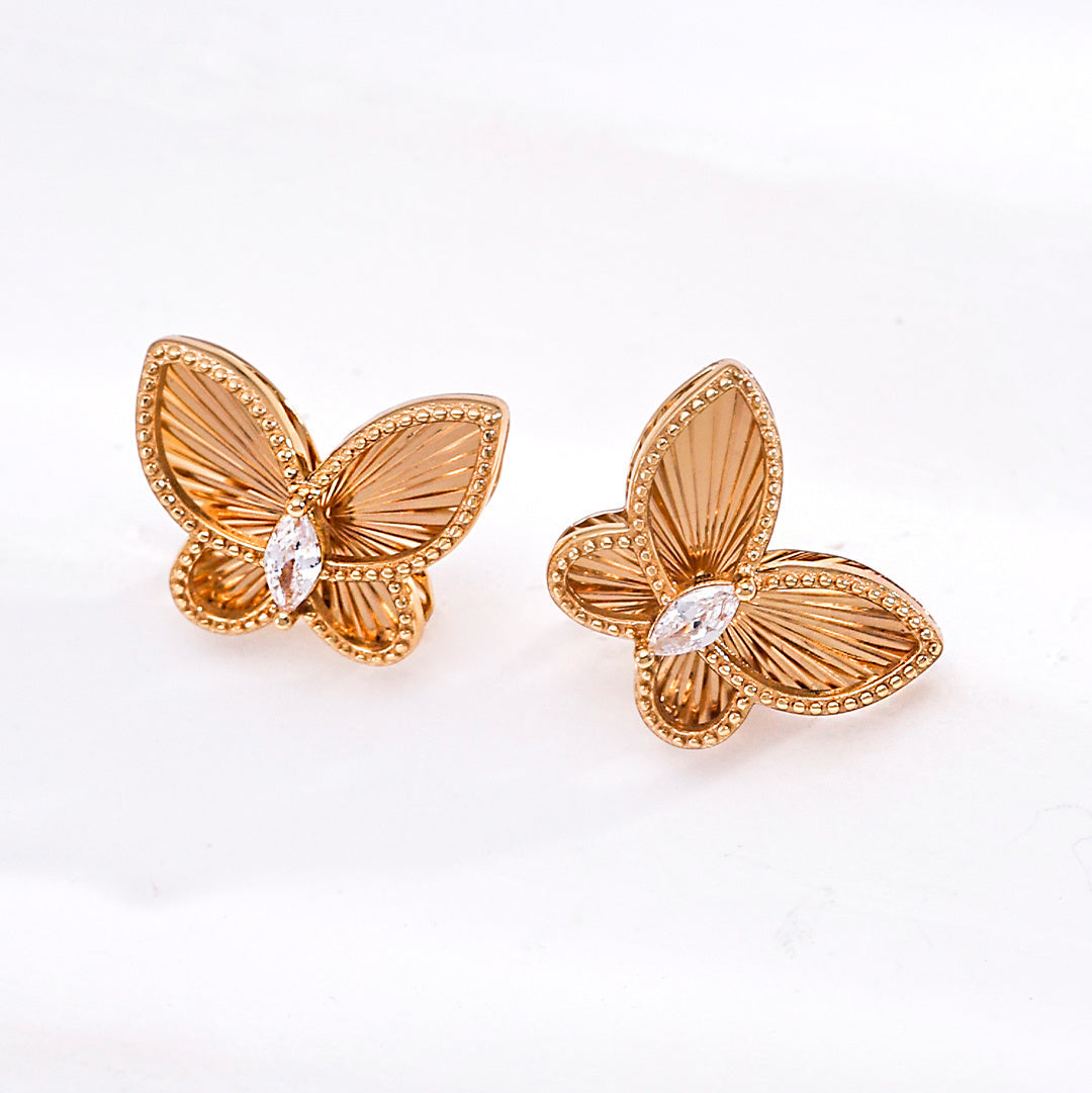 Vintage gold-tone butterfly stud earrings with cubic zirconia accents