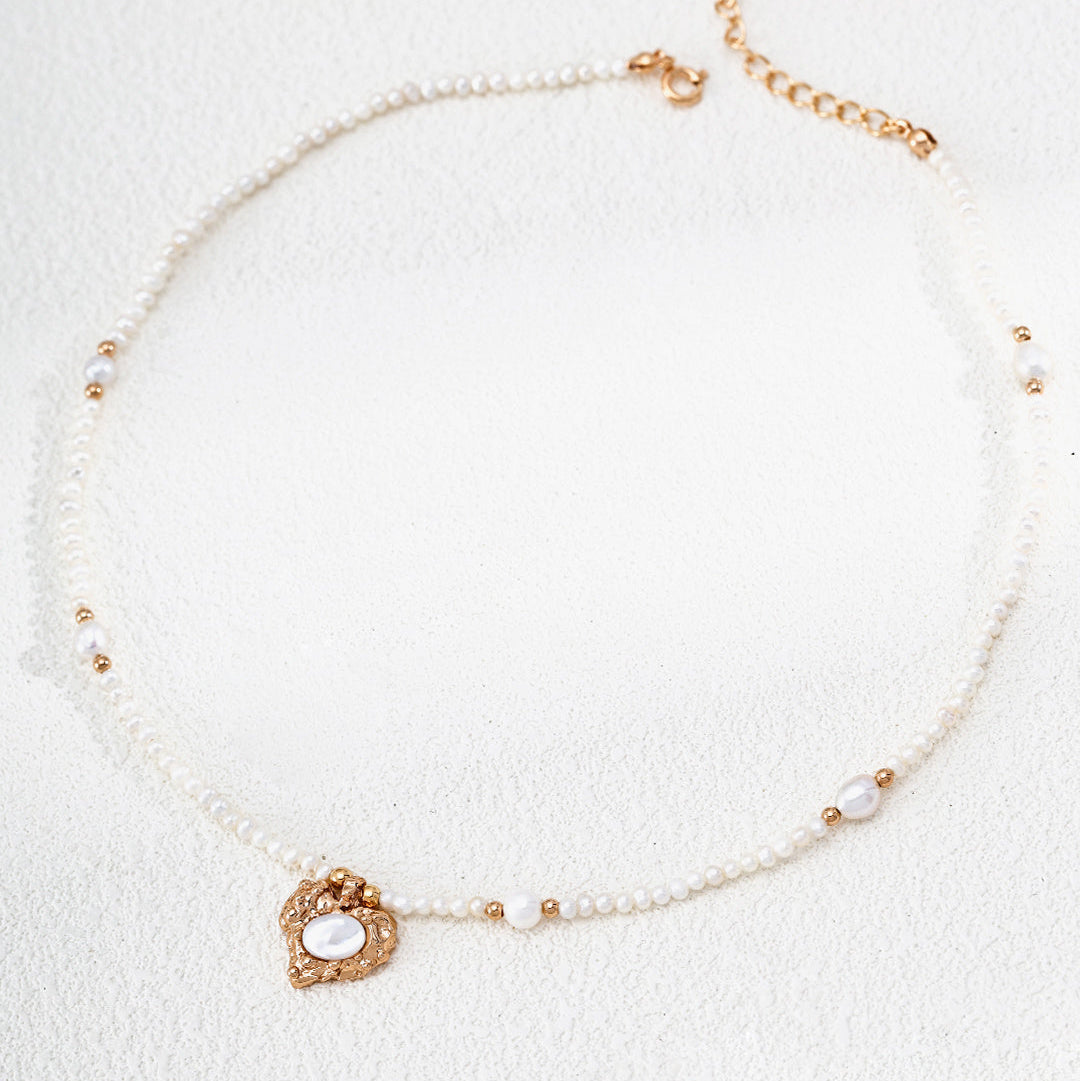 Mother-of-pearl heart pendant on a fine pearl strand