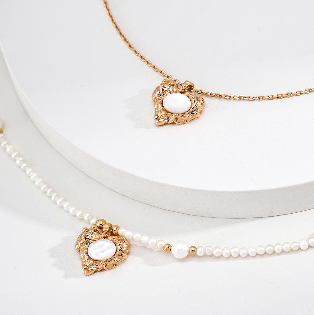 Pearl-strand and silver-chain versions of the mother-of-pearl heart necklace