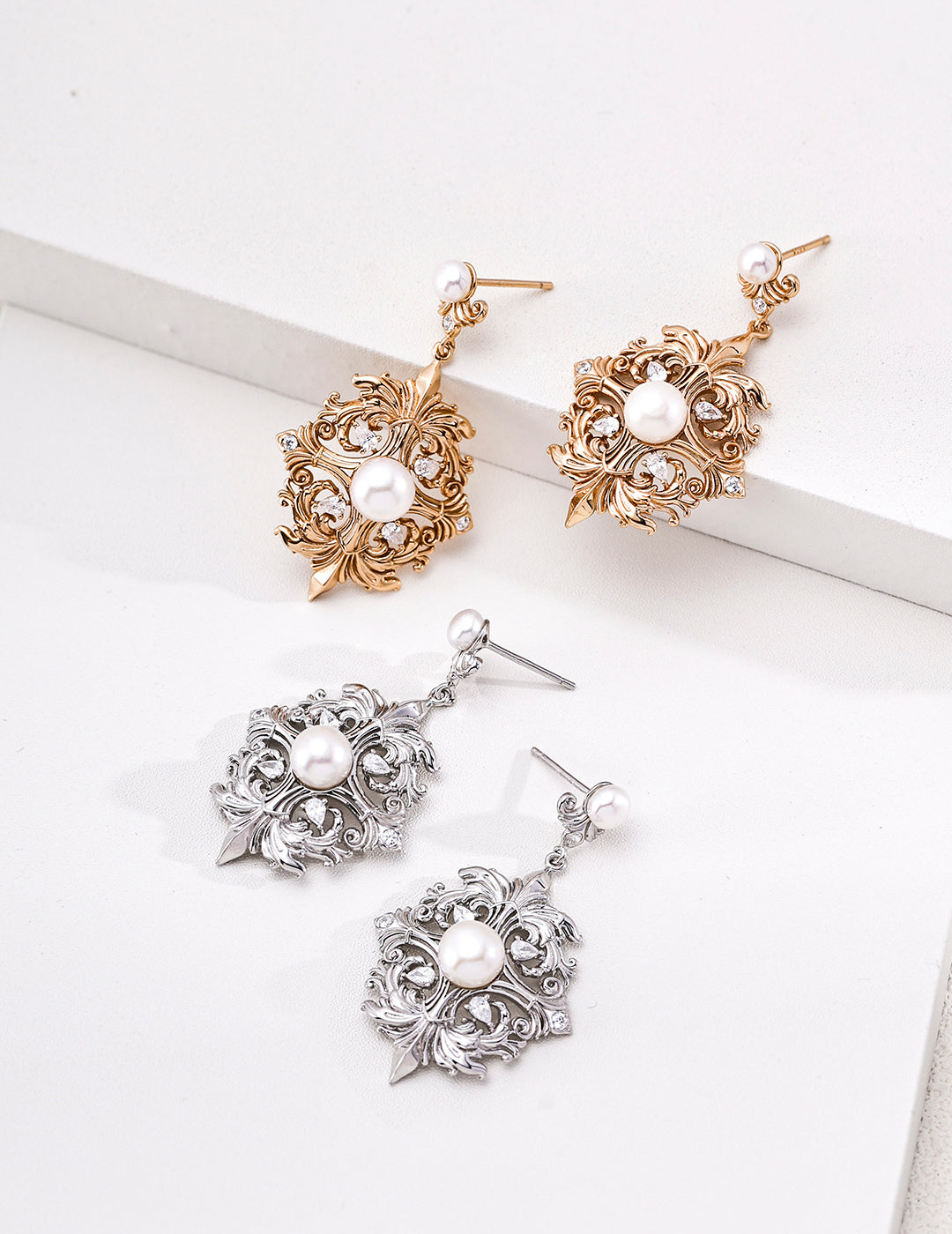 Coordinating floral medallion earrings in silver and vintage gold tones, sold separately