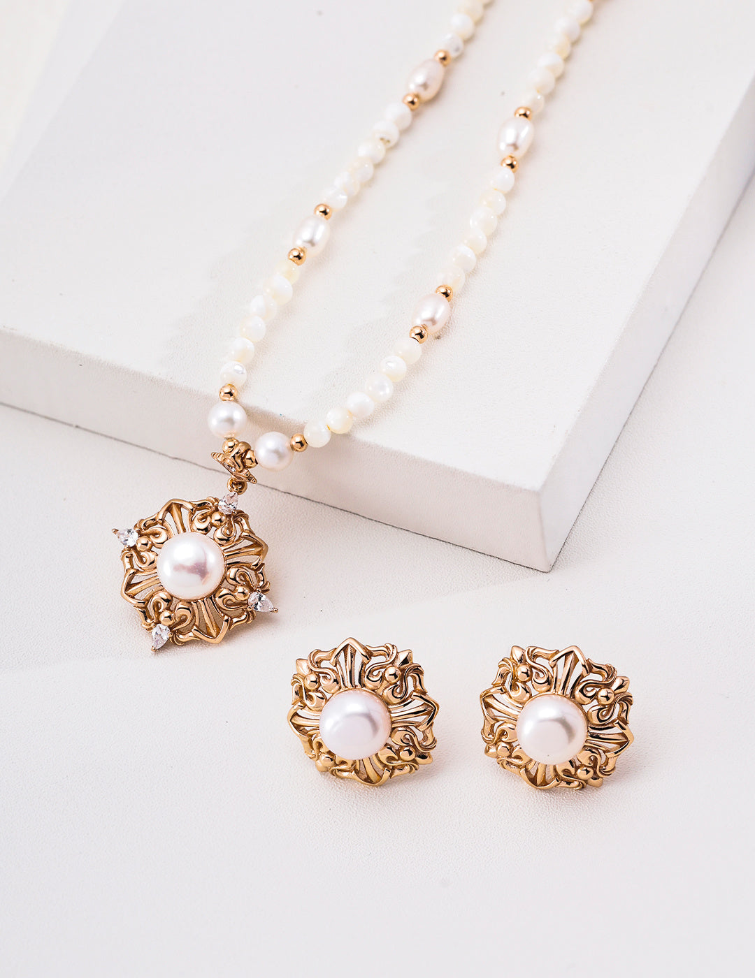 Vintage gold-tone pearl floral medallion necklace with separate matching earrings