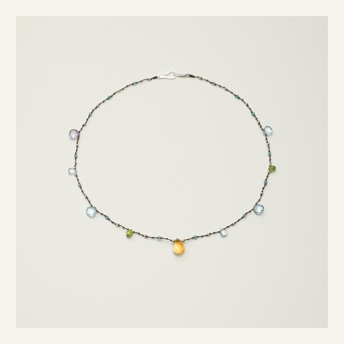 Violet Dew Blue Topaz Necklace product view on a clean neutral background